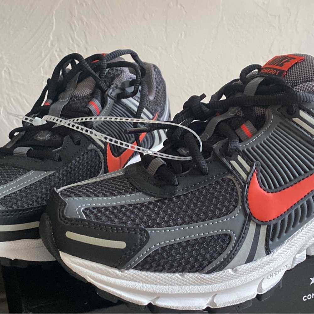 Nike Black and Red Sneakers with Bold Swoosh and Cushioned Comfort